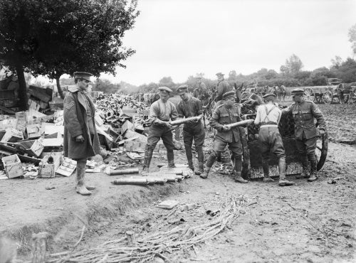 Gunners of the Royal Field Artillery loading 18-pounder shells into limbers. Acheux, Somme, July 1916.