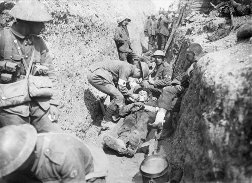 Wounded men being tended in a trench near Beaumont Hamel on the morning of the initial assault, Battle of the Somme, 1st July 1916.