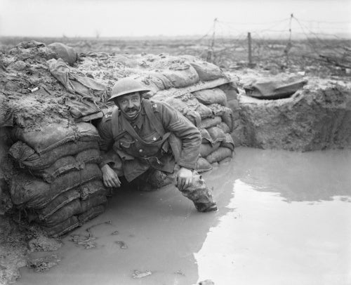 A sergeant of the Lancashire Fusiliers in a flooded dugout opposite Messines near Ploegsteert Wood, January 1917.