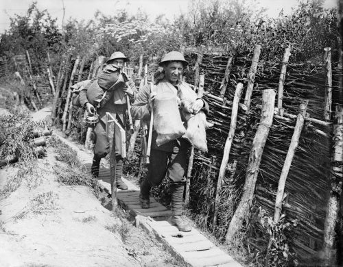 Two Irish Guardsmen going up a communication trench with supplies. Elverdinghe, 30 July 1917.
