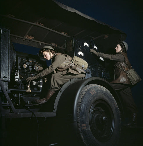 Two ATS girls operate a mobile power plant on an anti-aircraft gun site